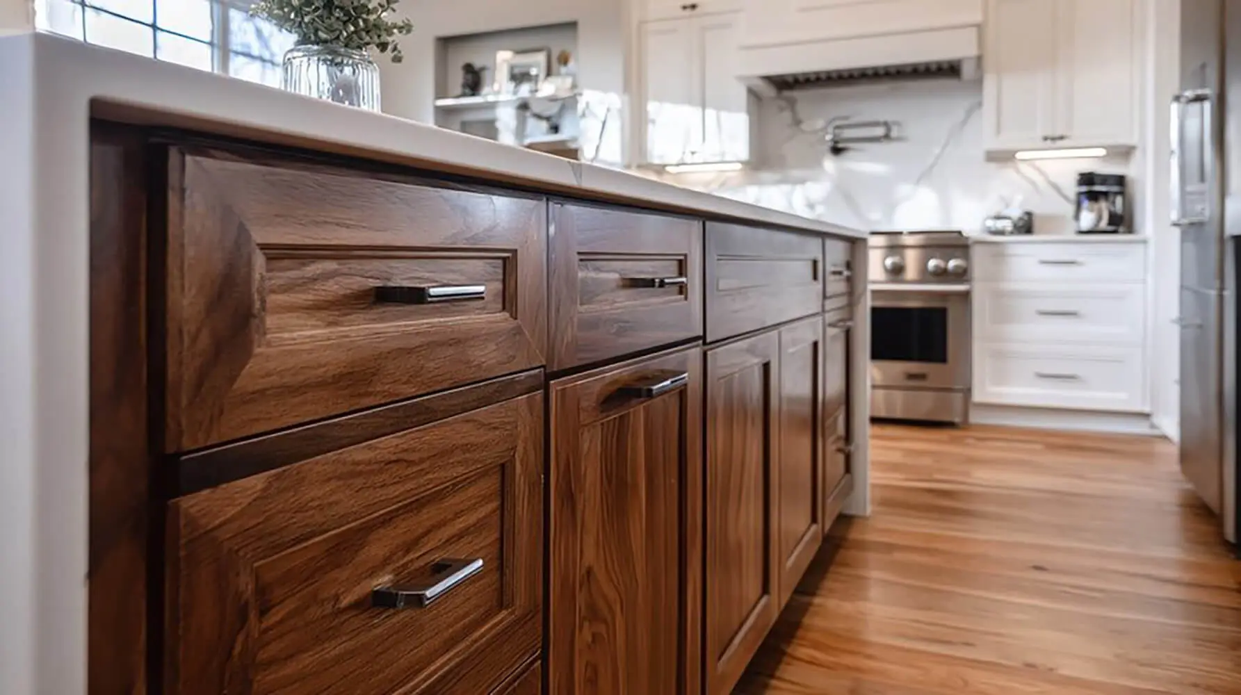 Kitchen island with wood cabinets showing cabinet refinishing vs replacement decision in a modern home