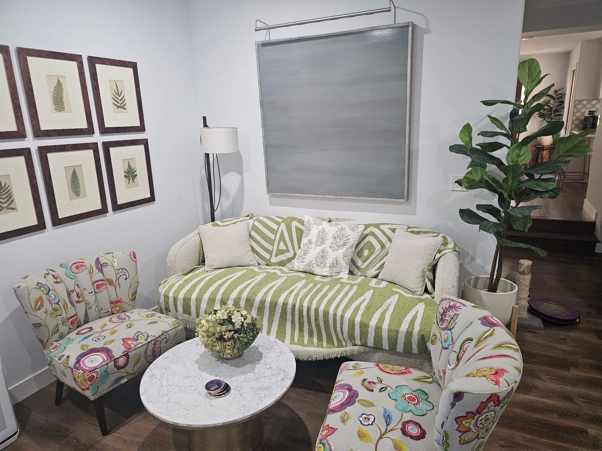 Bright and cozy living room with light neutral wall colors and clean interior painting, completed by Sucro Painting Contractors to create a fresh, welcoming space.