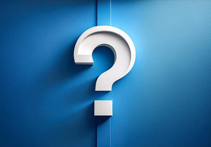 Question mark on a blue wall symbolizing questions you should ask before hiring an interior painter.